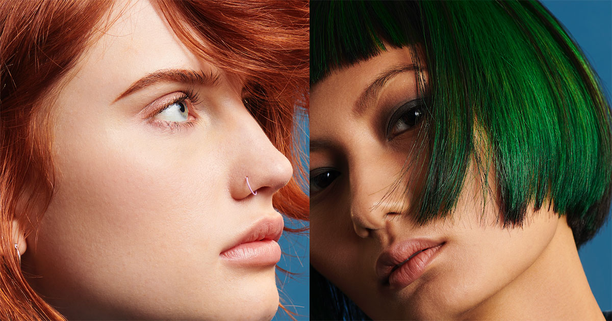 Close-up of two individuals with distinct hairstyles and colors; one has red hair and a nose ring, the other features a green bob haircut, both showcasing their unique looks as though fresh from a salon. - True Blue Salon | Nashville, TN